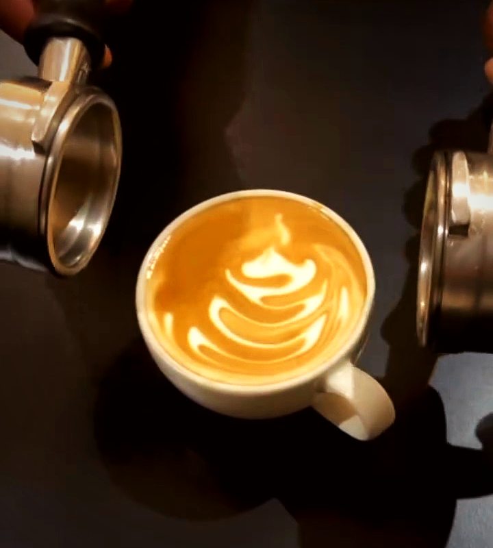 Milk being poured into a latte