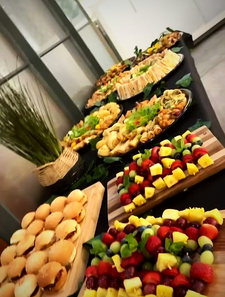 Grazing boards with fruit skewers, mini rolls and savoury bites