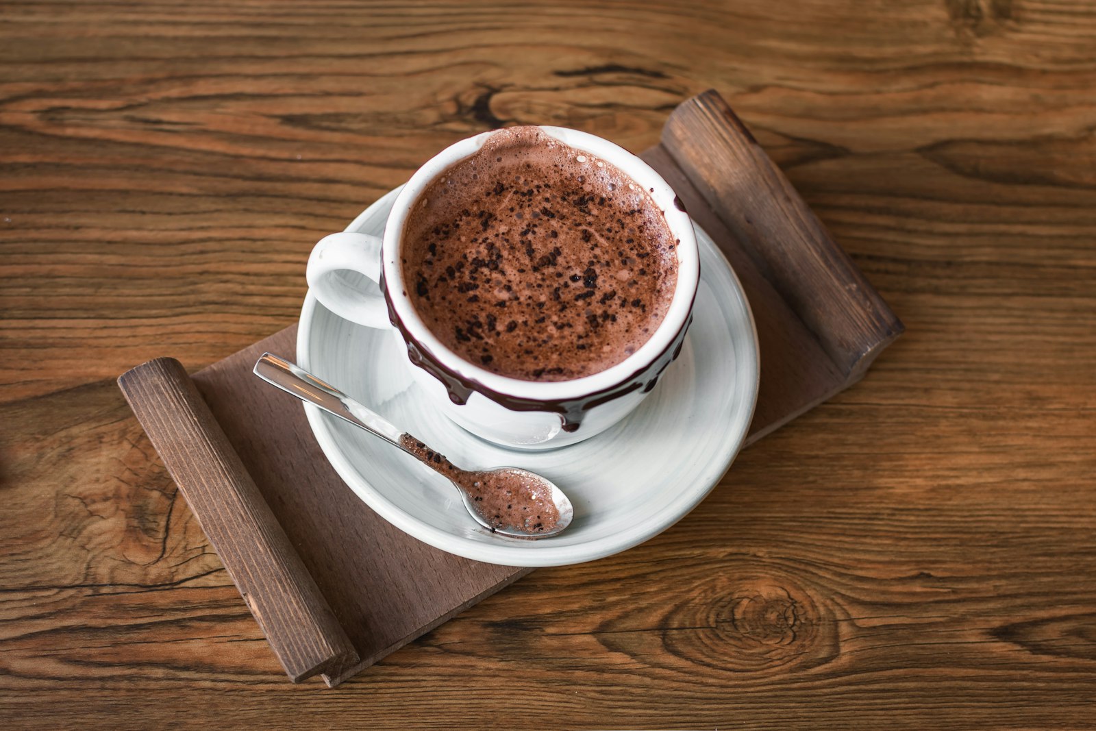 A cup of hot chocolate on a saucer