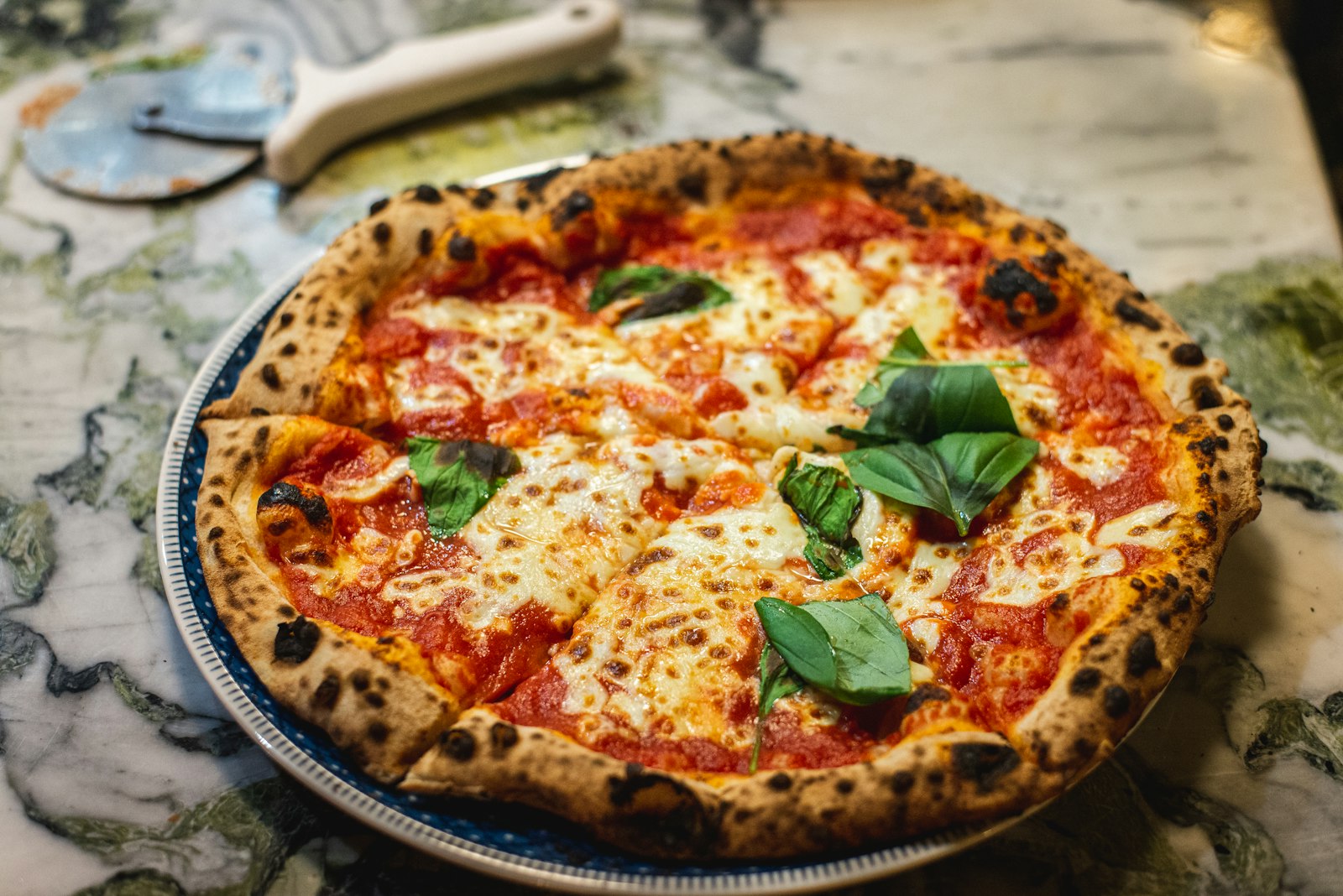 A margherita pizza with basil