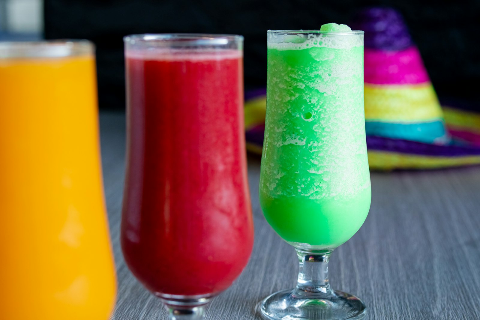 Three colourful frozen slush drinks