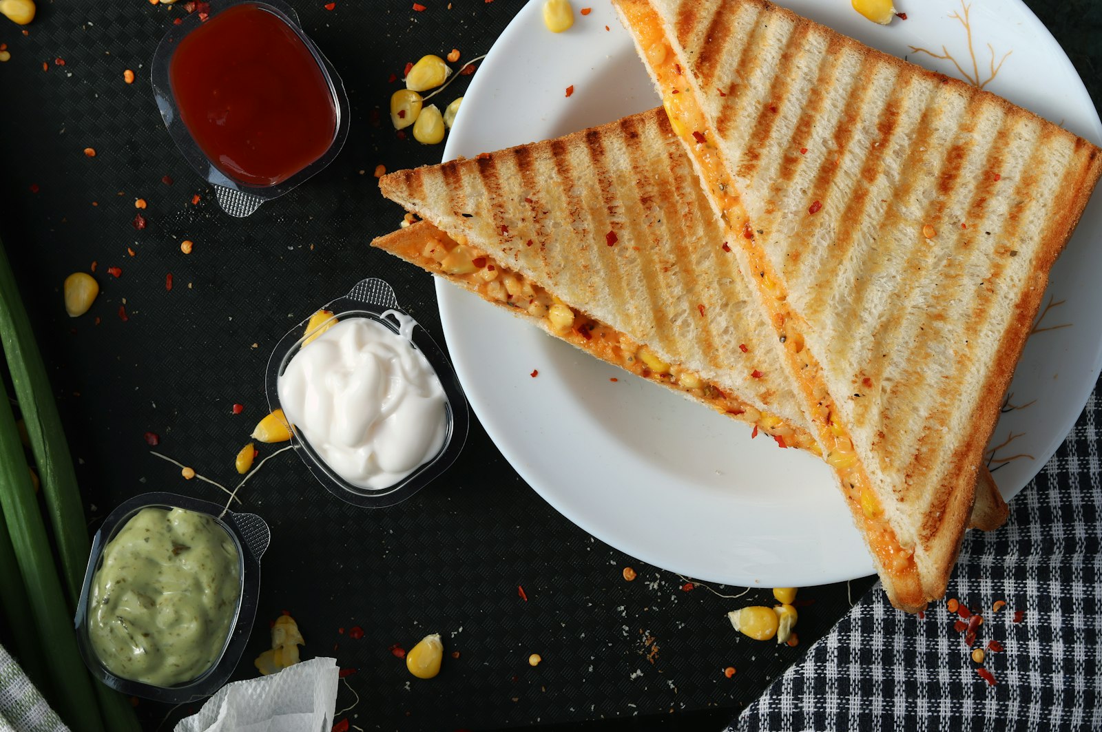 Toasted sandwiches cut in half on a plate